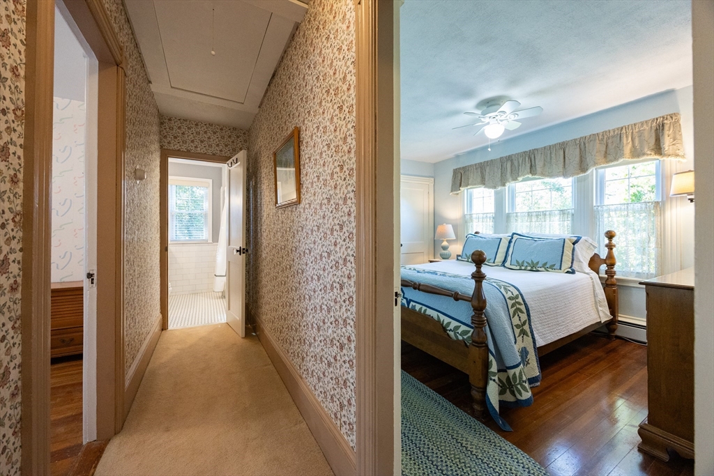 41 Roy Street Swampscott, MA 01907 - Photo 28 of 42 a bedroom with a bed and a mirror