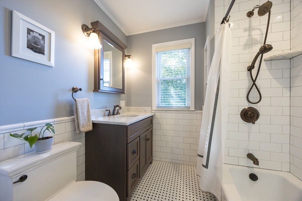 41 Roy Street Swampscott, MA 01907 - Photo 29 of 42 a bathroom with a sink toilet and shower