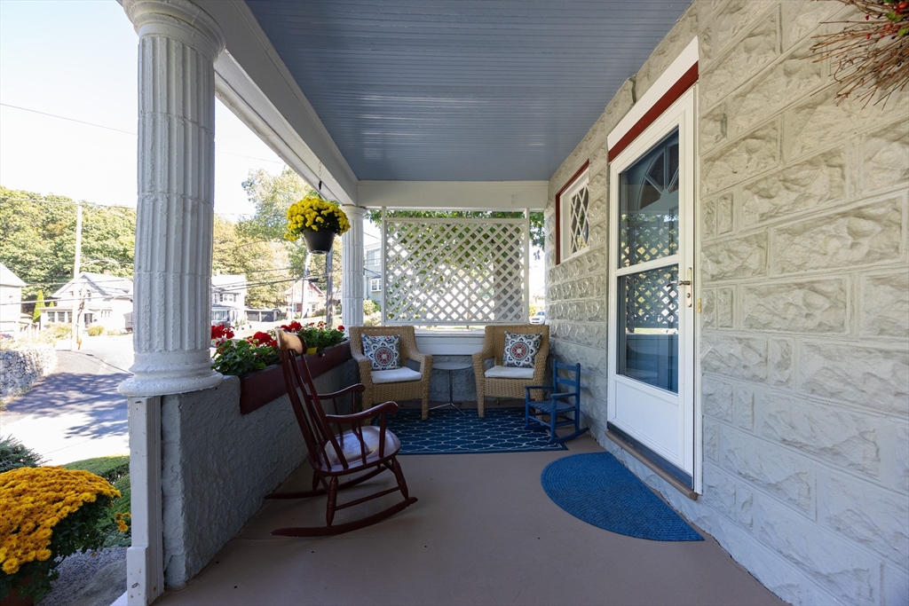 41 Roy Street Swampscott, MA 01907 - Photo 36 of 42 a living room with furniture and floor to ceiling windows