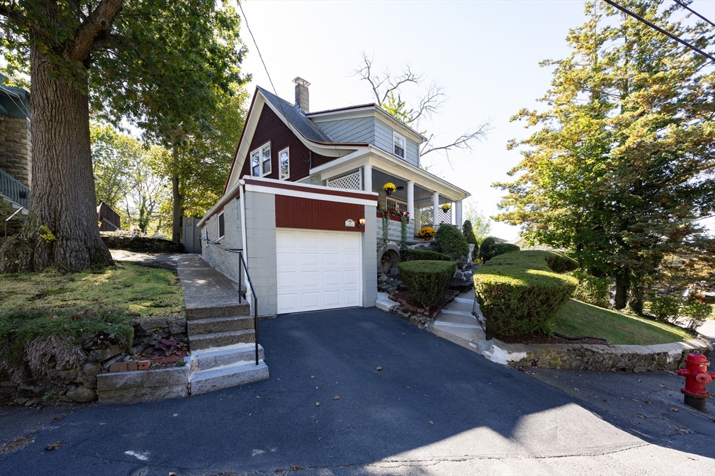 41 Roy Street Swampscott, MA 01907 - Photo 39 of 42 a front view of a house with a yard