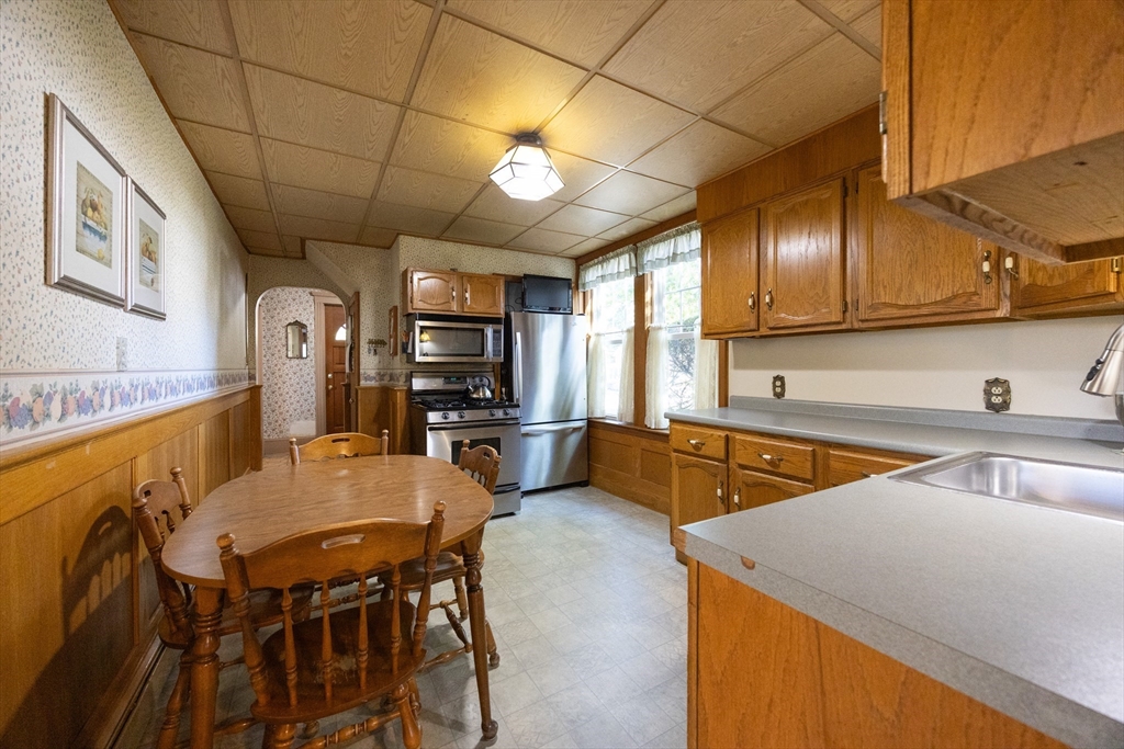 41 Roy Street Swampscott, MA 01907 - Photo 6 of 42 a kitchen with stainless steel appliances granite countertop a sink a stove counter space and cabinets