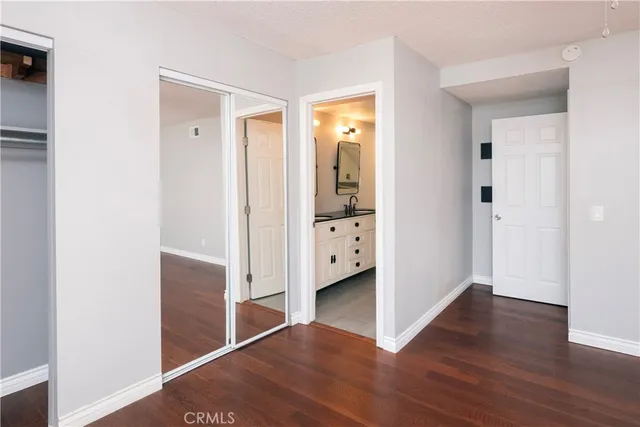 a bathroom with a double vanity sink and mirror