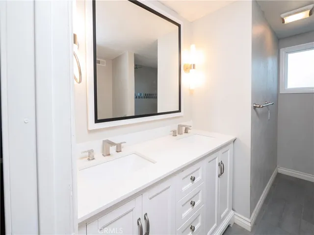 a bathroom with a white bath tub and a shower
