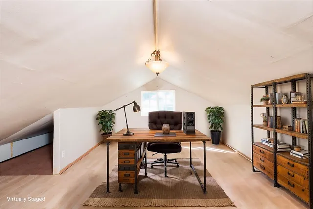 a workspace with furniture and window