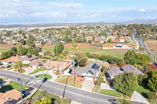 an aerial view of residential houses with outdoor space