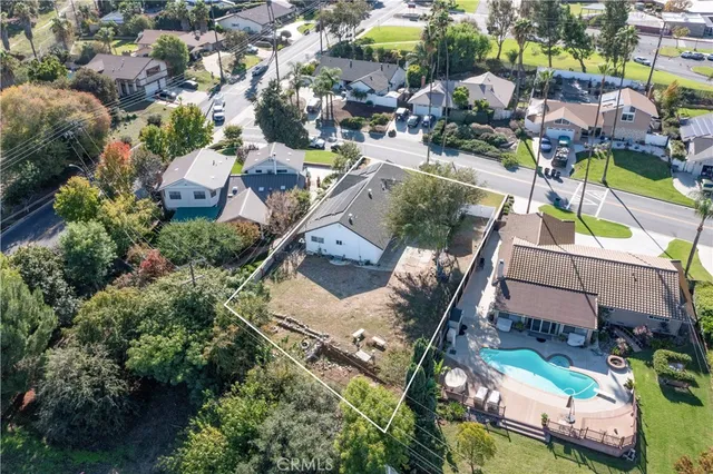 an aerial view of multiple houses with yard