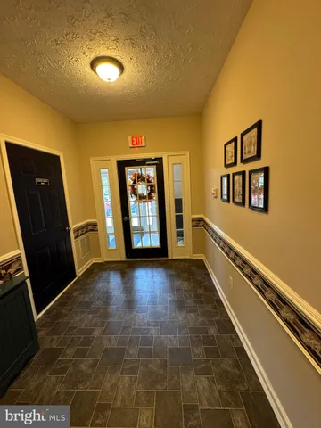a view of an empty room and a window