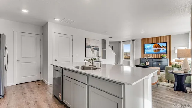 a kitchen with stainless steel appliances a sink and a stove top oven