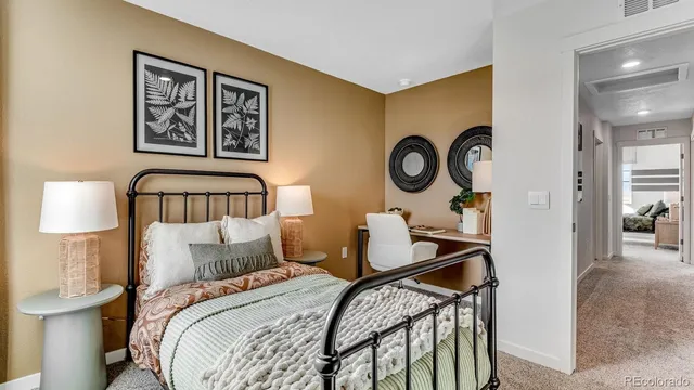 a bedroom with a bed and a mirror