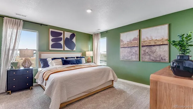 a bedroom with a bed and lamp