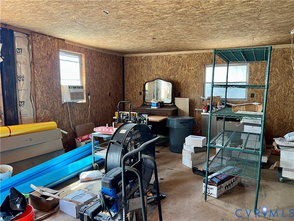 2049 Riddle Road Blackstone, VA 23824 - Photo 40 of 44 a view of a workspace with furniture and a window