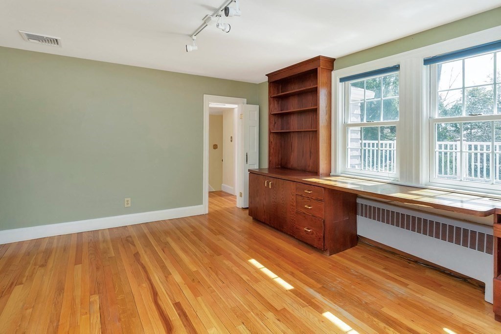 20 Kewadin Road Newton, MA 02468 - Photo 12 of 23 an empty room with wooden floor and windows