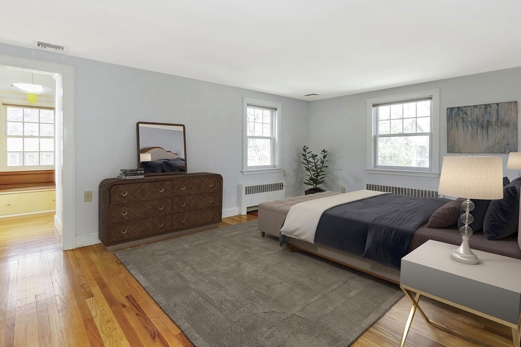 20 Kewadin Road Newton, MA 02468 - Photo 13 of 23 a bedroom with a bed and wooden floor
