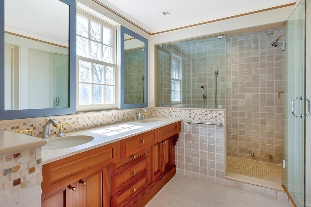 20 Kewadin Road Newton, MA 02468 - Photo 15 of 23 a bathroom with a sink and a mirror
