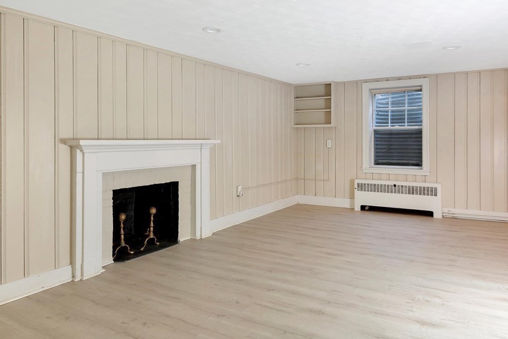 20 Kewadin Road Newton, MA 02468 - Photo 18 of 23 a view of empty room with a fireplace and entryway