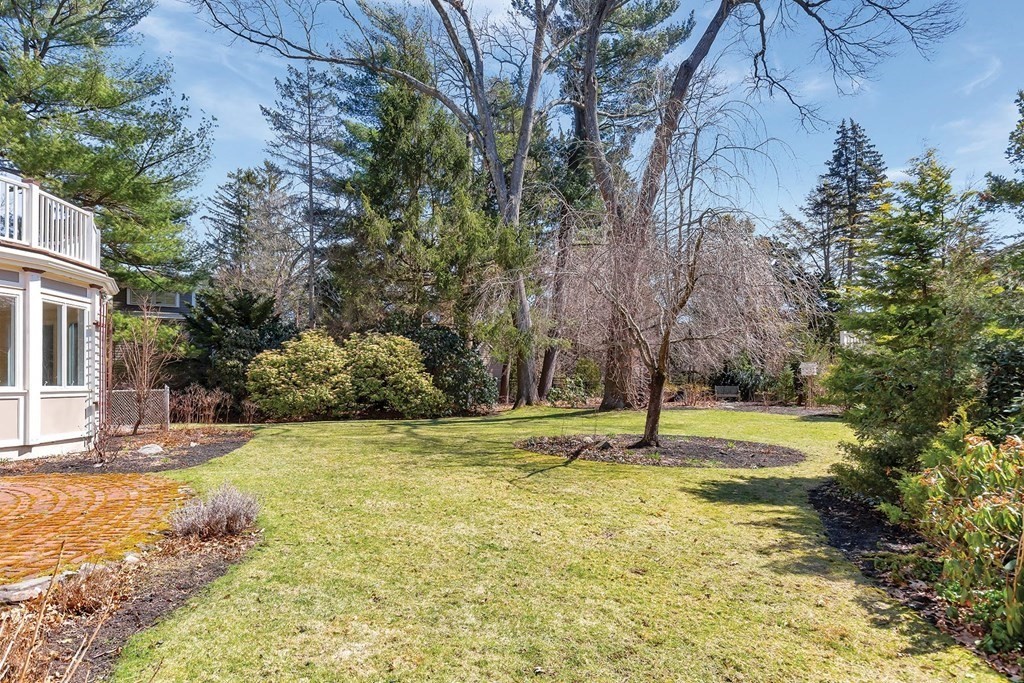 20 Kewadin Road Newton, MA 02468 - Photo 20 of 23 a swimming pool with an outdoor space and seating area