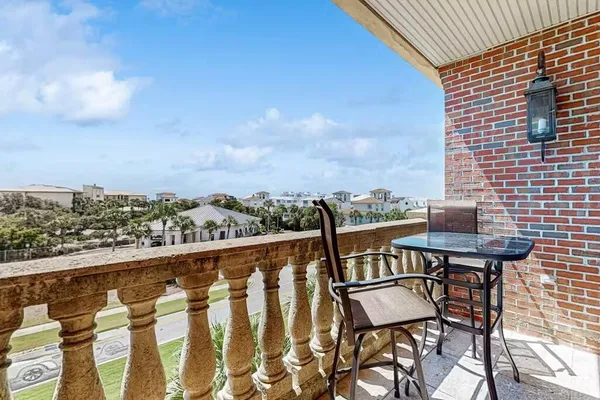 a view of a balcony with chairs