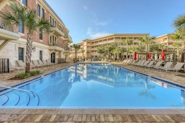 a view of a swimming pool with an outdoor seating