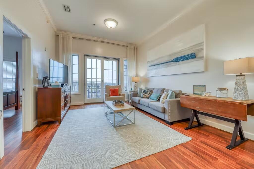 10343 East County Highway 30A, Unit 328 Inlet Beach, FL 32413 - Photo 2 of 16 a living room with furniture a lamp wooden floor and a table