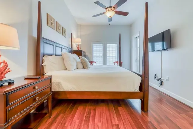 a bed room with a bed and a chandelier