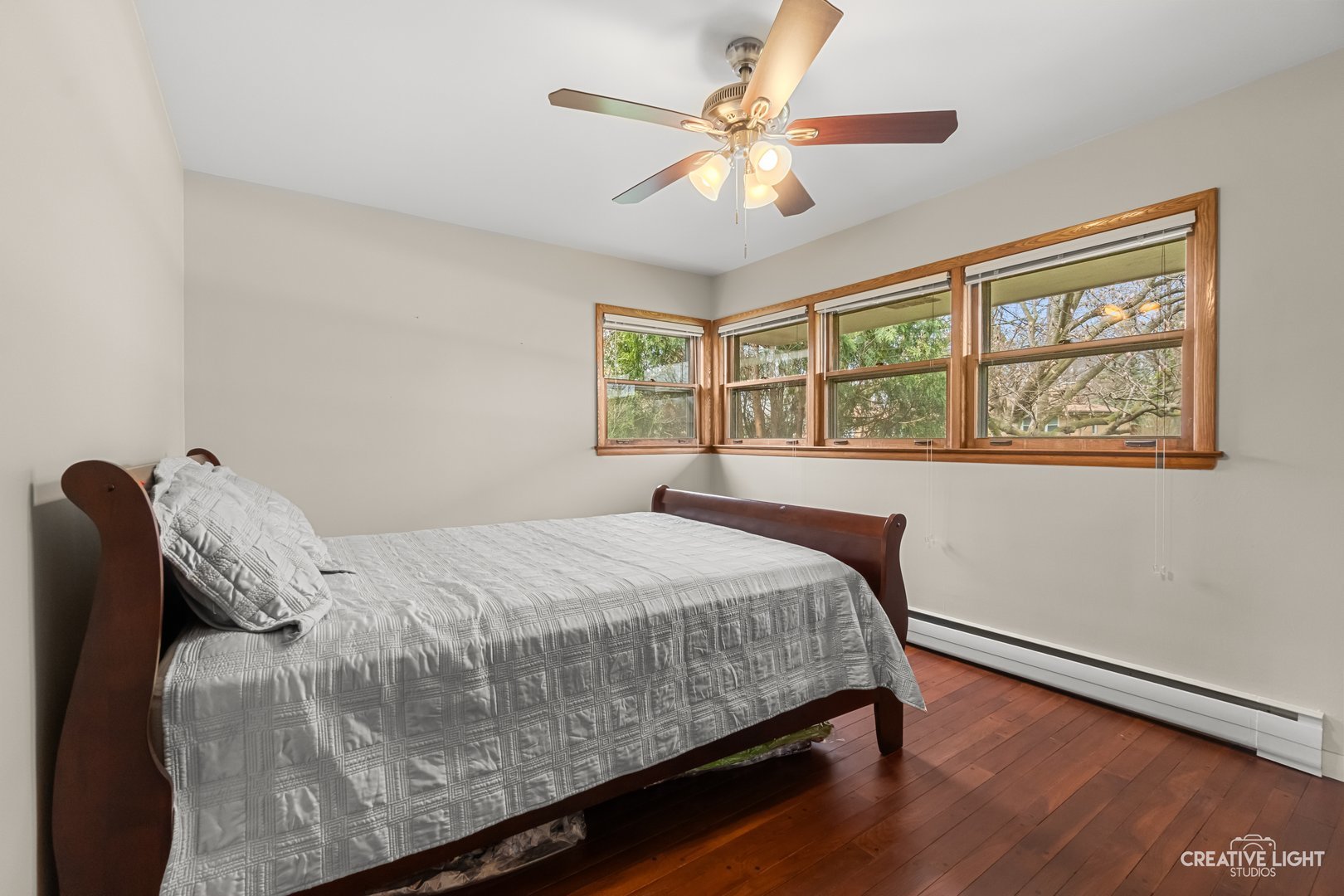 1005 Meadow Lane Elgin, IL 60123 - Photo 11 of 22 a bedroom with a large bed and a window