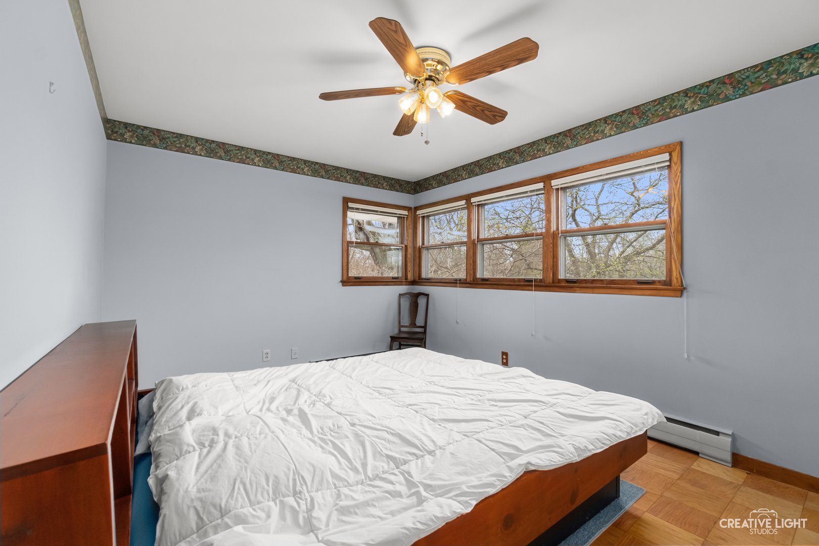 1005 Meadow Lane Elgin, IL 60123 - Photo 12 of 22 a bedroom with a large bed and a window