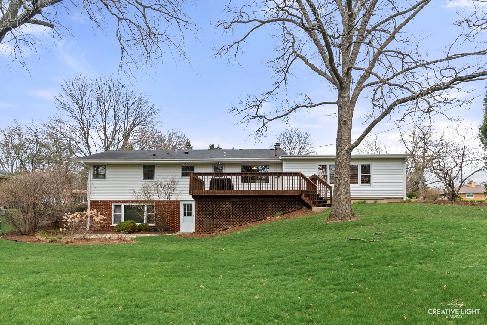 1005 Meadow Lane Elgin, IL 60123 - Photo 19 of 22 a view of a house with a yard and sitting area