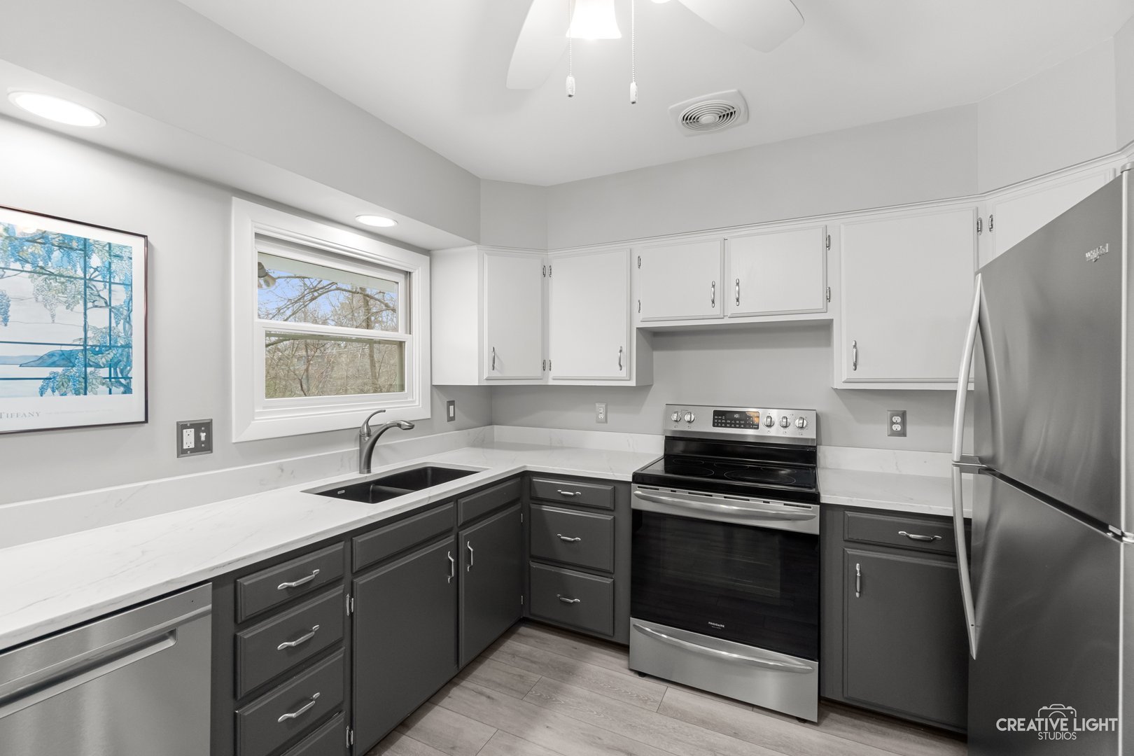 1005 Meadow Lane Elgin, IL 60123 - Photo 7 of 22 a kitchen with a sink stove and refrigerator