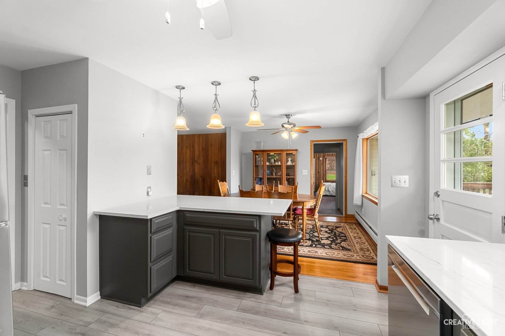 1005 Meadow Lane Elgin, IL 60123 - Photo 8 of 22 a large kitchen with kitchen island a sink stainless steel appliances and cabinets