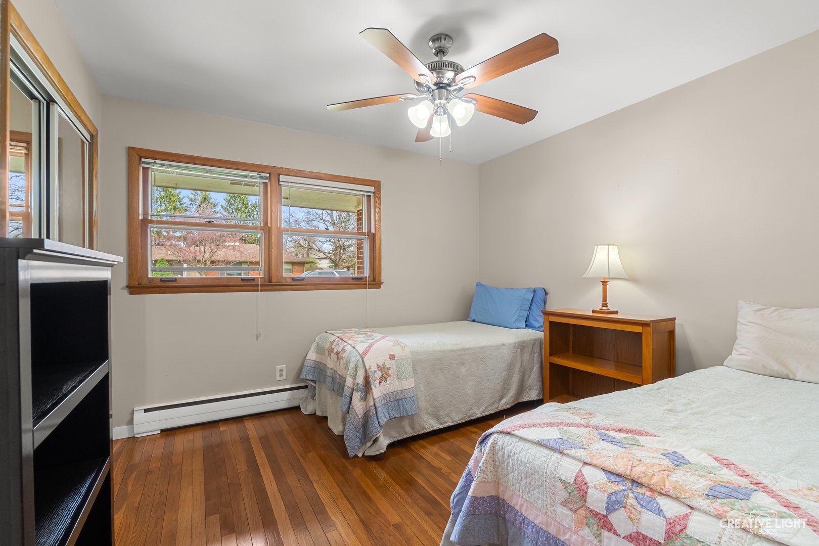 1005 Meadow Lane Elgin, IL 60123 - Photo 10 of 22 a bedroom with two beds and a chandelier