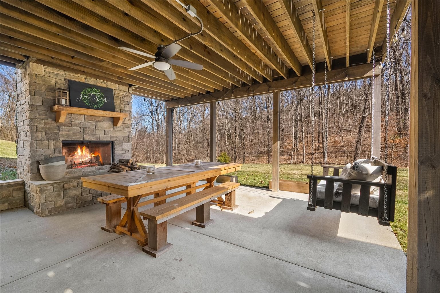 6833 Falls Ridge Lane College Grove, TN 37046 - Photo 61 of 70 a living room with patio furniture and a fireplace