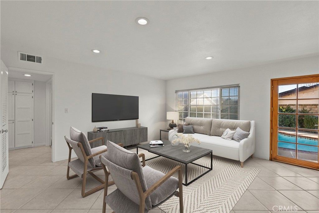 25550 Old Course Way Valencia, CA 91355 - Photo 20 of 48 virtually staged family room off kitchen