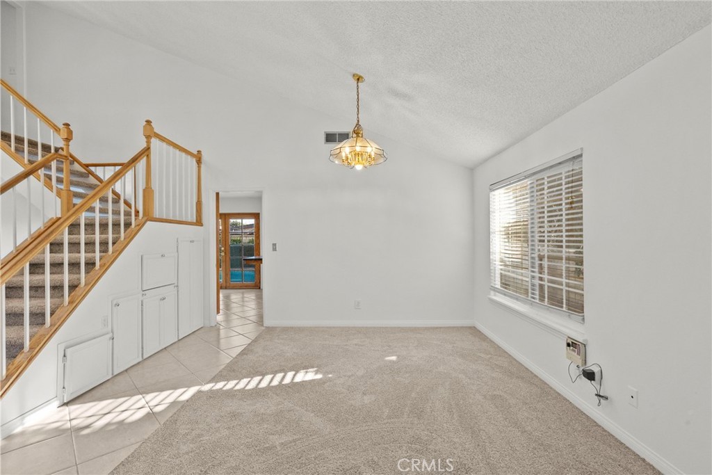25550 Old Course Way Valencia, CA 91355 - Photo 8 of 48 Living/Dining area by stairs