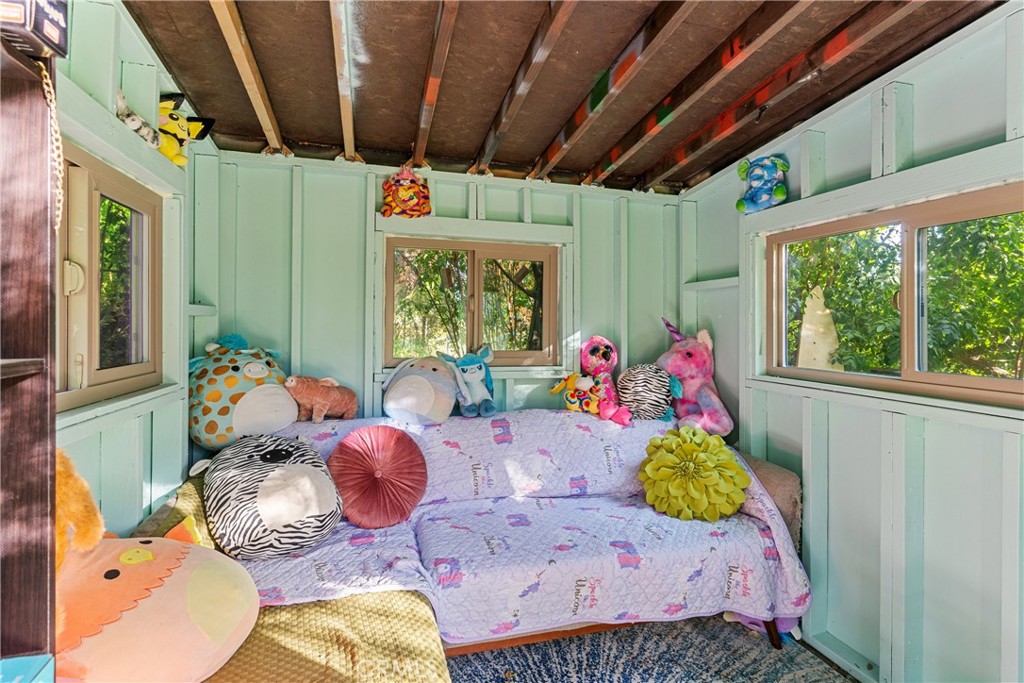 6608 Via Siena Rancho Palos Verdes, CA 90275 - Photo 18 of 52 a bedroom with furniture and a large window