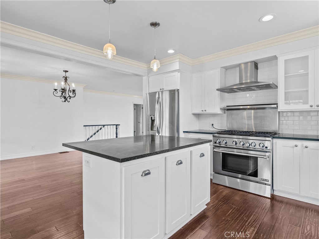 6608 Via Siena Rancho Palos Verdes, CA 90275 - Photo 27 of 52 a kitchen with granite countertop a sink stainless steel appliances and cabinets