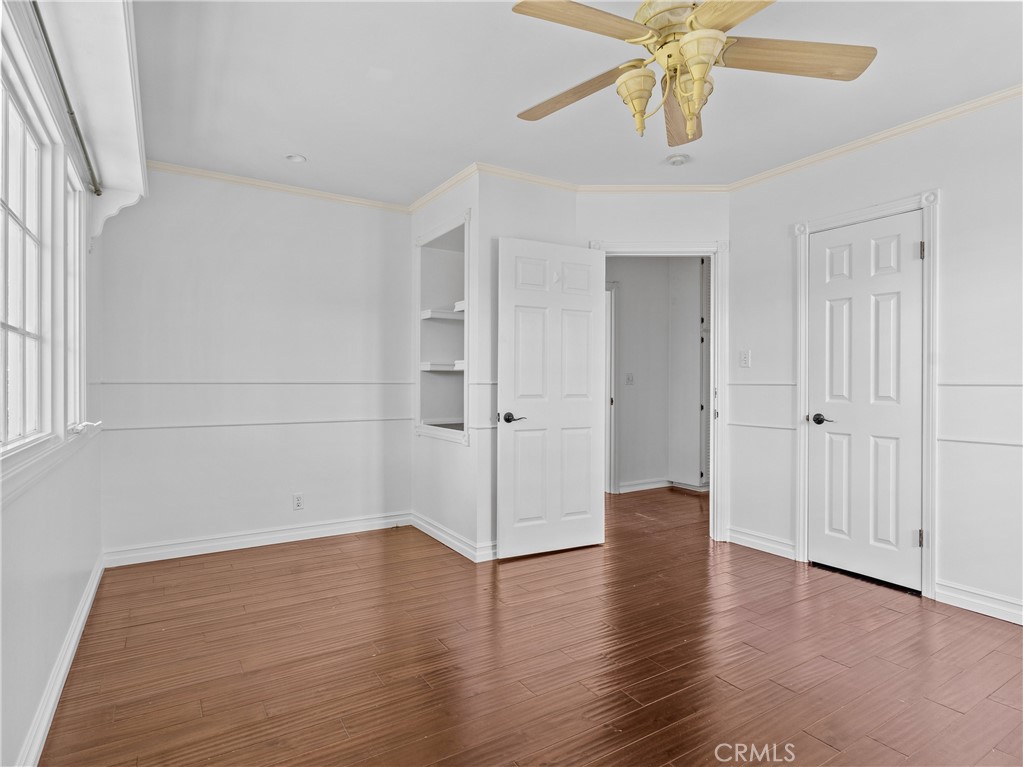 6608 Via Siena Rancho Palos Verdes, CA 90275 - Photo 38 of 52 an empty room with wooden floor chandelier fan and closet area