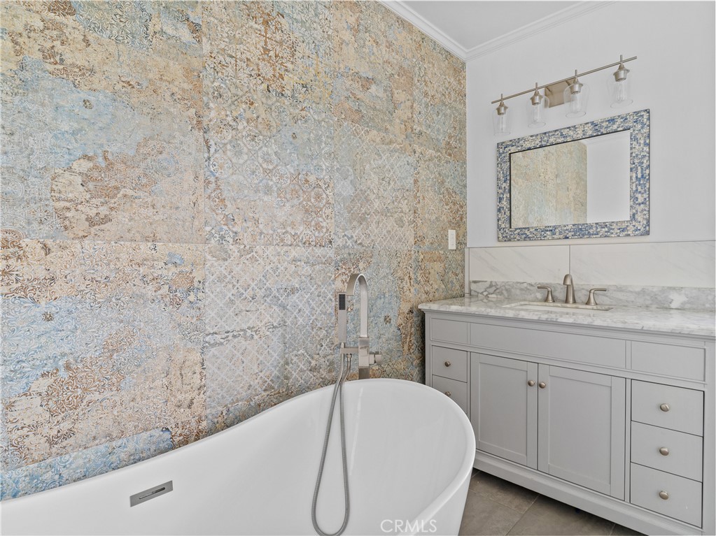 6608 Via Siena Rancho Palos Verdes, CA 90275 - Photo 40 of 52 a bathroom with a granite countertop sink a toilet and mirror