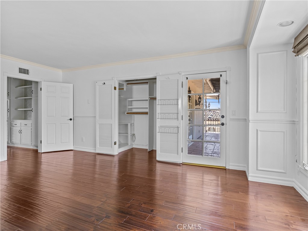 6608 Via Siena Rancho Palos Verdes, CA 90275 - Photo 44 of 52 an empty room with cabinet and wooden floor