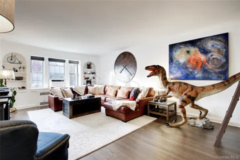 a living room with furniture a rug and a large window