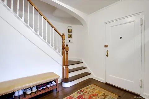 a view of staircase with white walls