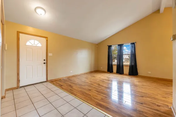 a view of an empty room and window