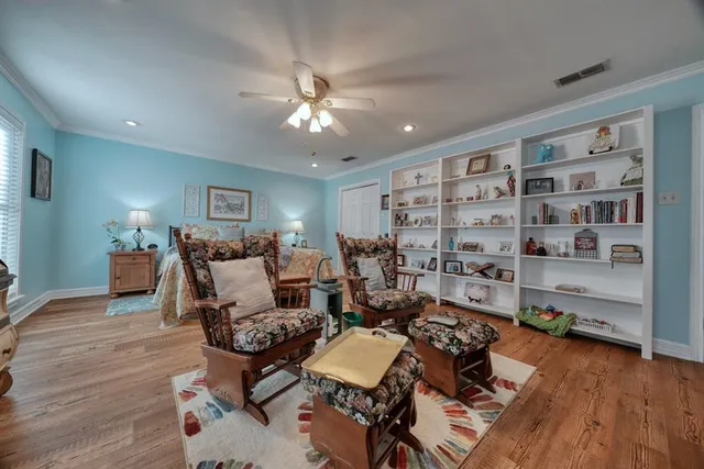 a very nice looking living room with furniture and wooden floor