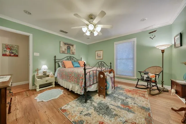 a bedroom with a bed and a table in it