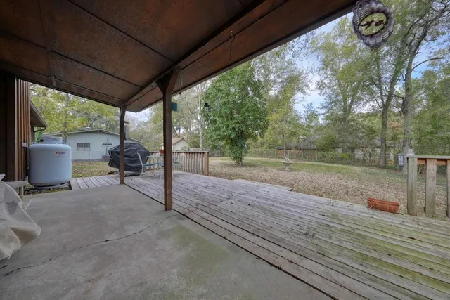 a view of a room with wooden floor and iron fence