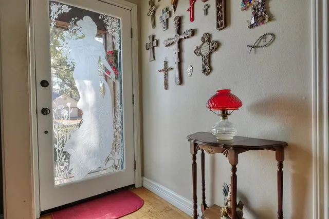 a view of a hallway with paintings on the wall