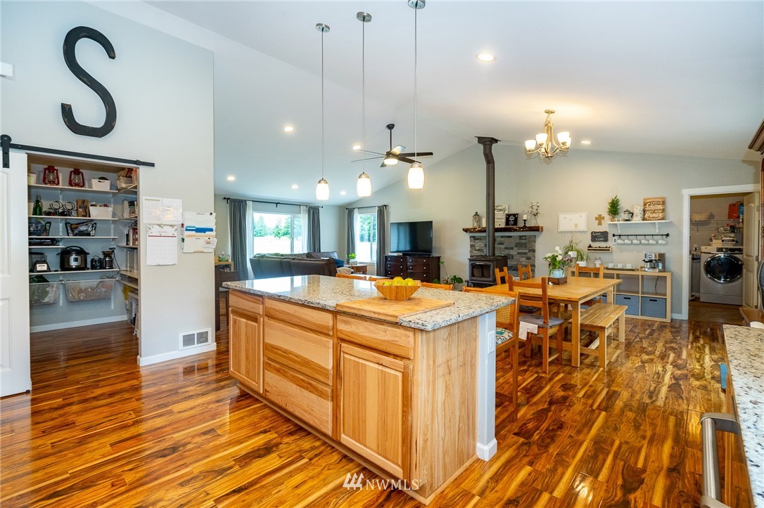 665 Rhoades Road Winlock, WA 98596 - Photo 12 of 39 a kitchen with stainless steel appliances granite countertop a sink a counter space and cabinets