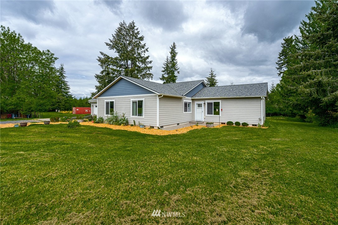 665 Rhoades Road Winlock, WA 98596 - Photo 26 of 39 a front view of a house with a garden