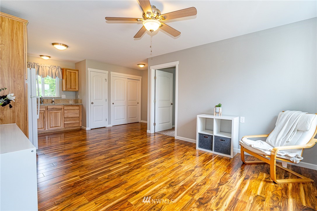 665 Rhoades Road Winlock, WA 98596 - Photo 28 of 39 a view of a room with wooden floor and furniture