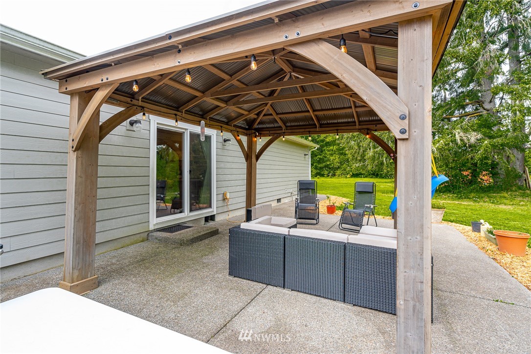 665 Rhoades Road Winlock, WA 98596 - Photo 35 of 39 a view of a chair and table in the patio and a yard