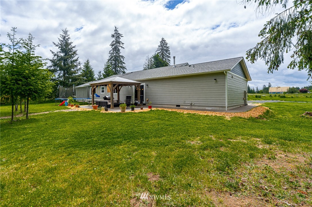 665 Rhoades Road Winlock, WA 98596 - Photo 36 of 39 a view of a house with a yard